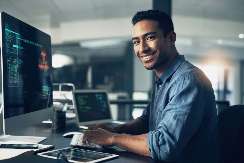 Portrait of a man using a computer in a modern office